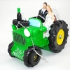Młoda Para na traktorze. Długość traktora:13cm Wysokość figurki:11cm